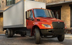 International MVu2122 SERIES 45581_MV_Box_Truck_Sunrise_WITH_People_sRGB_2021_1920x625